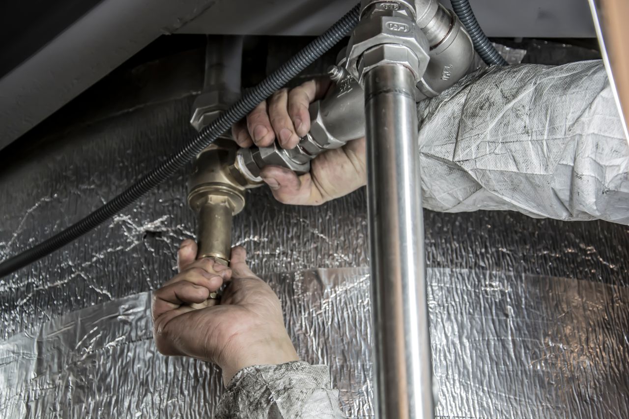 Plumber installing a bathroom faucet and sink